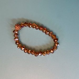 Crystal bracelet with larger center bead. Elastic and.